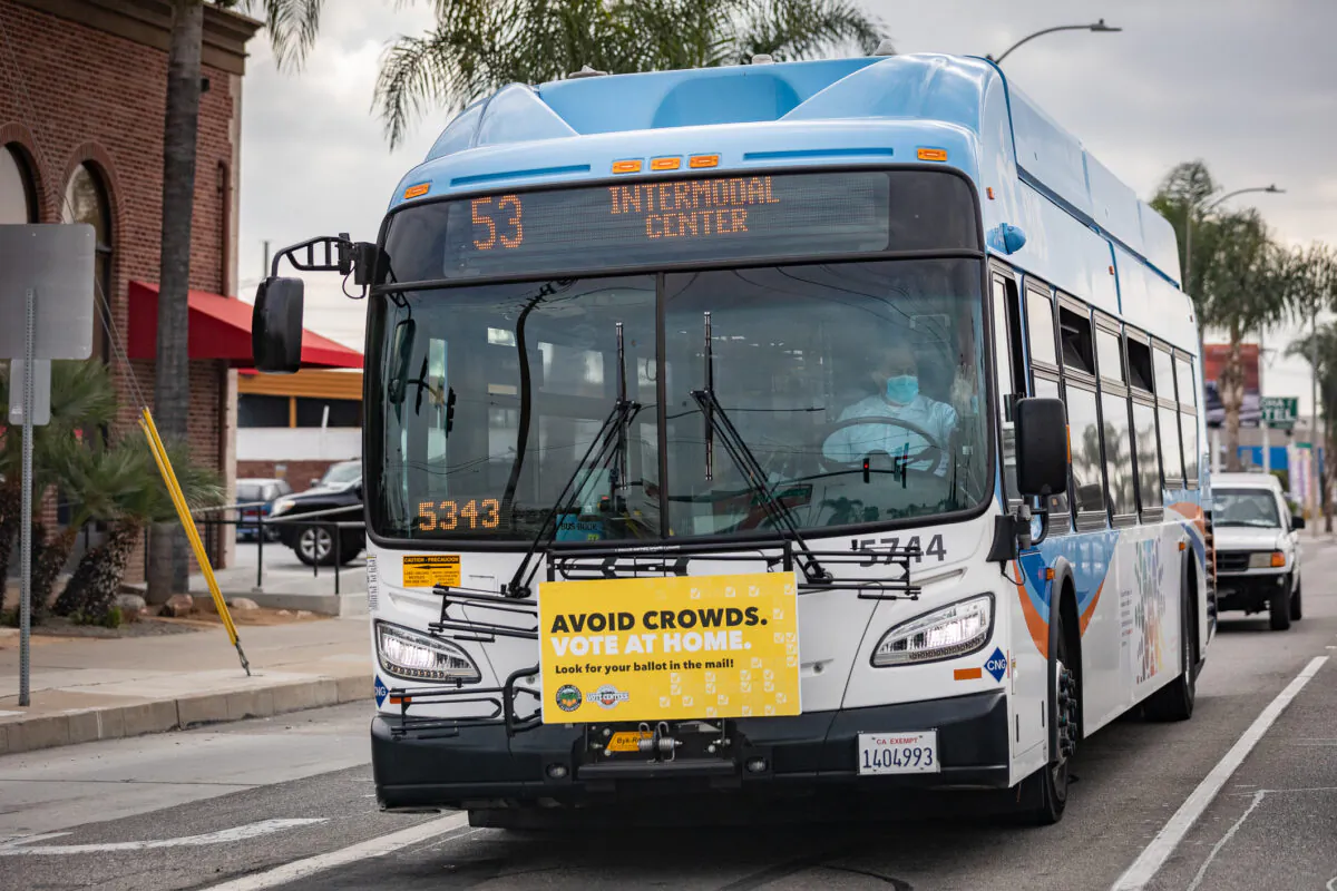 An Orange County Transportation Authority bus transports passengers in Santa Ana, Calif., on Dec. 11, 2020. (John Fredricks/The Epoch Times)