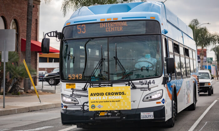 An Orange County Transportation Authority bus transports passengers in Santa Ana, Calif., on Dec. 11, 2020. (John Fredricks/The Epoch Times)