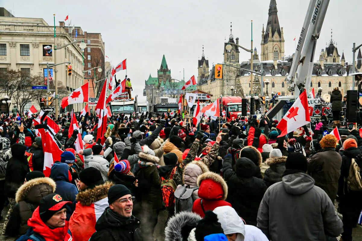 People demonstrate as part of the truckers’ Freedom Convoy protest against COVID-19 mandates and restrictions in Ottawa on Feb. 6, 2022. (Jonathan Ren/The Epoch Times)