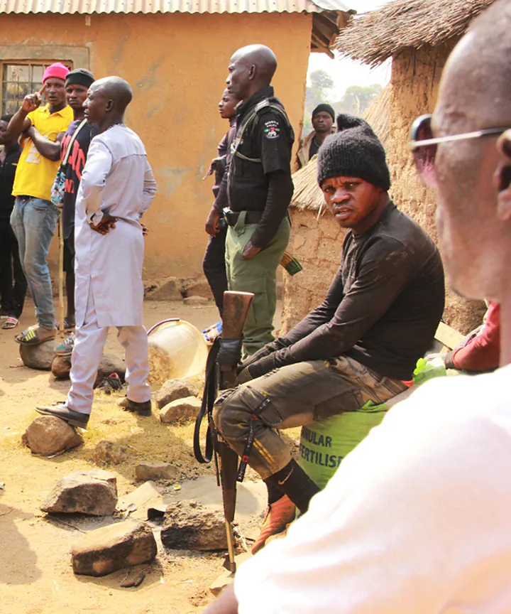 An armed community guard in a Nigerian village. (Courtesy of Masara Kim)