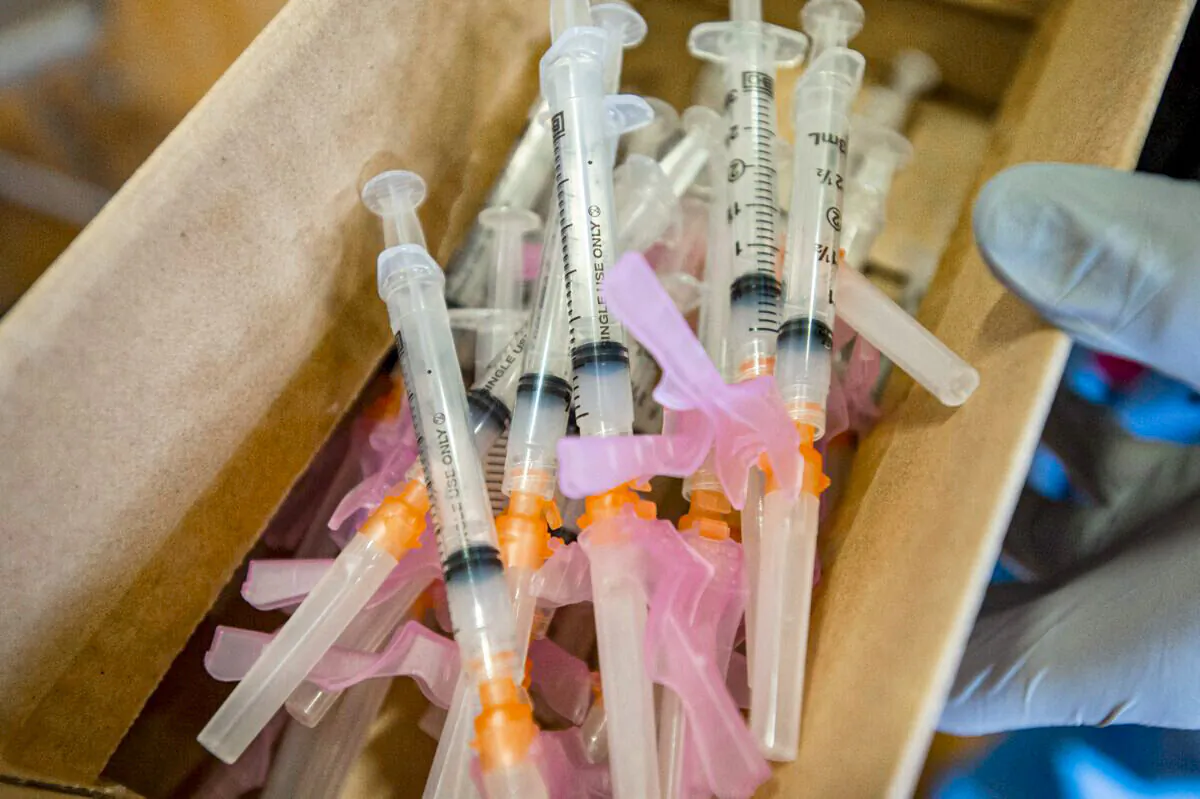 Syringes with a COVID-19 vaccine are pictured in Central Falls, R.I., in a file photograph. (Joseph Prezioso/AFP via Getty Images)