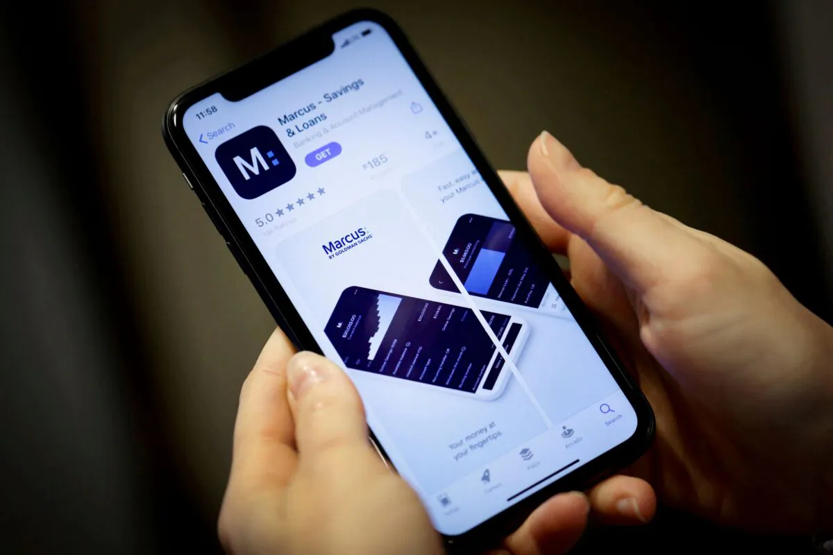 A woman looks at Marcus, a savings and loans app by Goldman Sachs, N.Y., on Jan. 10, 2020. (Mike Segar/Reuters)