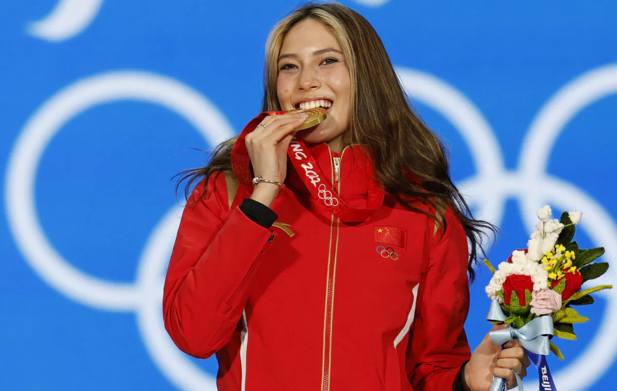 Freestyle skier Eileen Gu of China celebrates on the podium after winning a gold medal in the big air competition of the 2022 Beijing Winter Olympics, on Feb. 8, 2022. (Tyrone Siu/Reuters)
