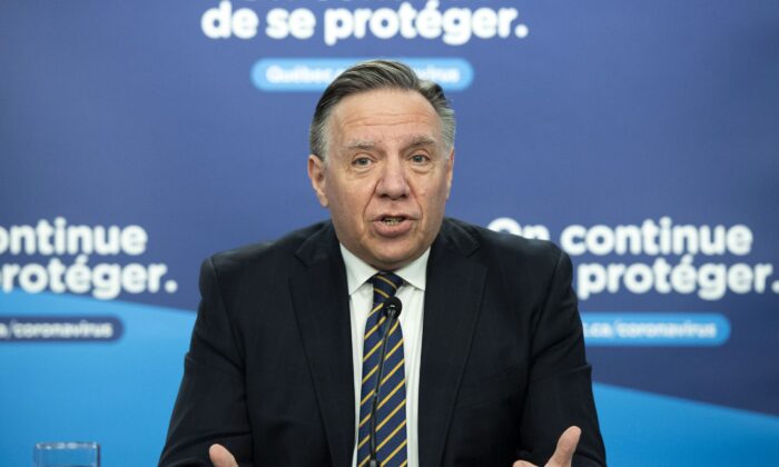 Quebec Premier Francois Legault speaks to the media at a COVID-19 press briefing in Montreal on Jan. 25, 2022. (The Canadian Press/Graham Hughes)