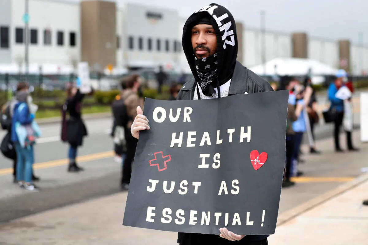 Former Amazon employee Christian Smalls stands with fellow demonstrators during a protest outside of an Amazon warehouse as the outbreak of the coronavirus disease (COVID-19) continues in the Staten Island borough of New York U.S. on May 1, 2020. (Lucas Jackson/Reuters)