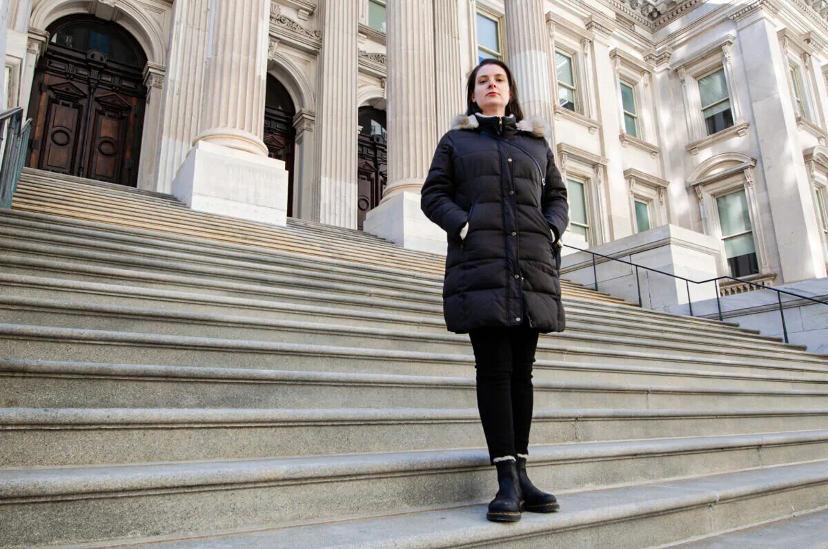 Unvaccinated elementary school teacher, Nadia Lyakhnovich, in front of one of New York City’s Department of Education buildings. (Dave Paone/The Epoch Times)