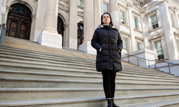 Unvaccinated elementary school teacher, Nadia Lyakhnovich, in front of one of New York City’s Department of Education buildings. (Dave Paone/The Epoch Times)