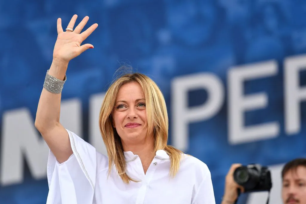 Head of Fratelli d’Italia (Brothers of Italy) party, Giorgia Meloni waves from the stage during a united rally of the League (Lega) party, the Brothers of Italy party and the Forza Italia (FI) party for a protest against the government in Piazza del Popolo in Rome, Italy, on July 4, 2020. (Tiziana Fabi/AFP via Getty Images)