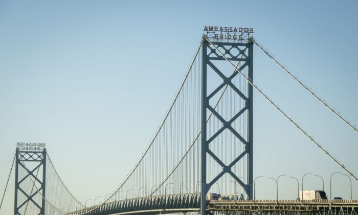 Vehicles travel across the Ambassador Bridge that connects Detroit and Windsor, Canada, in Detroit, Mich., on Nov. 8, 2021. (Nic Antaya/Getty Images)