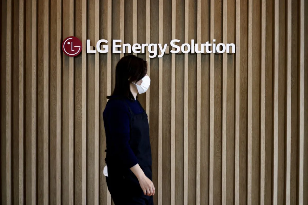 An employee walks past the logo of LG Energy Solution at its office building in Seoul, South Korea, on Nov. 23, 2021. (Kim Hong-Ji/Reuters)