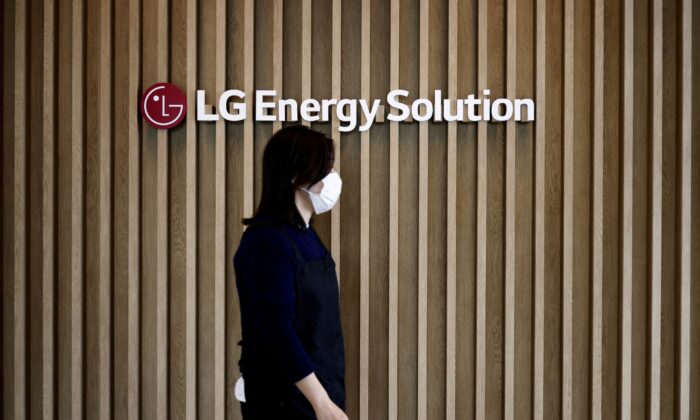 An employee walks past the logo of LG Energy Solution at its office building in Seoul, South Korea, on Nov. 23, 2021. (Kim Hong-Ji/Reuters)