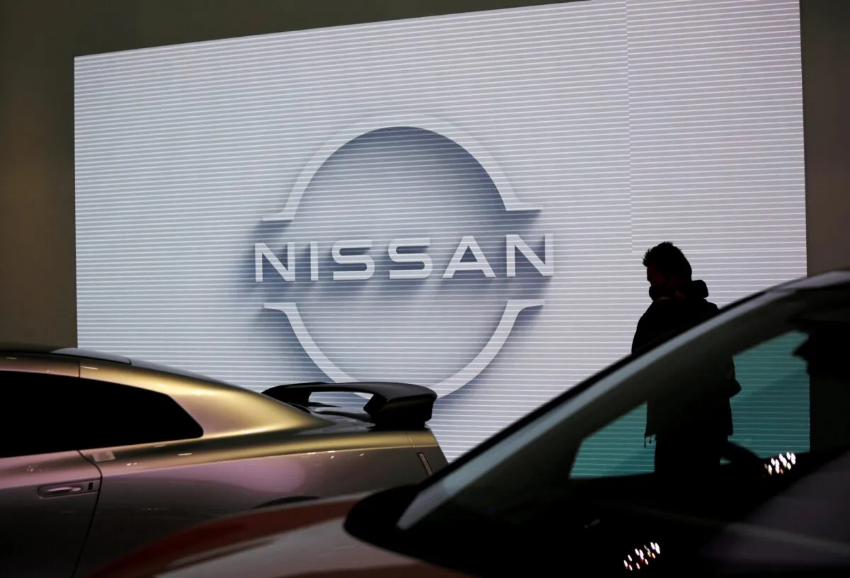 A visitor is seen at a Nissan Motor Corp. showroom in Tokyo, Japan, on Nov. 11, 2020. (Issei Kato/Reuters)