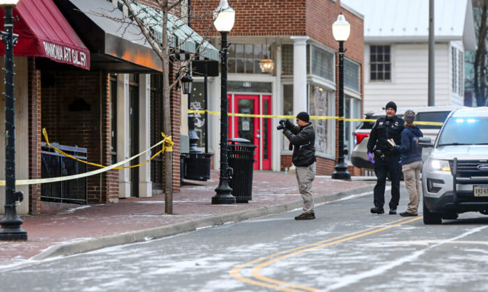 Police investigate a the scene of a fatal shooting on Main Street in Blacksburg, Va., on Feb. 5 2022. (Matt Gentry/The Roanoke Times via AP)