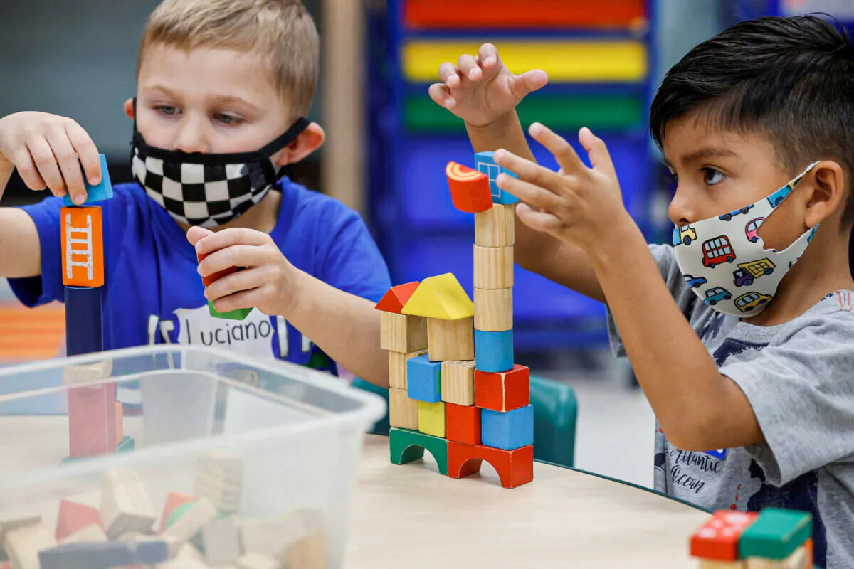 Children wear masks in a school in a file image. (Jonathan Ernst/Reuters)