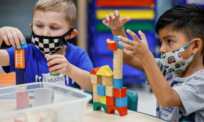 Children wear masks in a school in a file image. (Jonathan Ernst/Reuters)