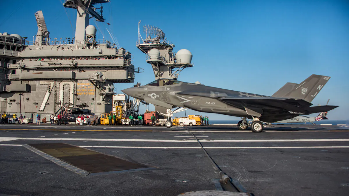 An F-35C Lightning II from the 'Rough Raiders' of Strike Fighter Squadron (VFA) 125 preparing to make an arrested cable landing on the flight deck of the Nimitz-class aircraft carrier USS Carl Vinson (CVN 70), off the coast of Southern California, on Oct. 18, 2017. 
(Sean M. Castellano/ Navy Office of Information/AFP via Getty Images)