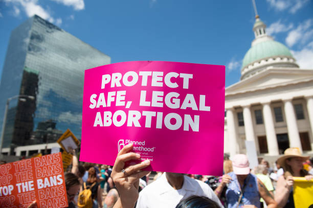 Protesters hold signs as they rally in support of Planned Parenthood and pro-choice and to protest a state decision that would effectively halt abortions by revoking the center's license to perform the procedure, near the Old Courthouse in St. Louis, Missouri, May 30, 2019. (Saul Loeb/AFP via Getty Images)
