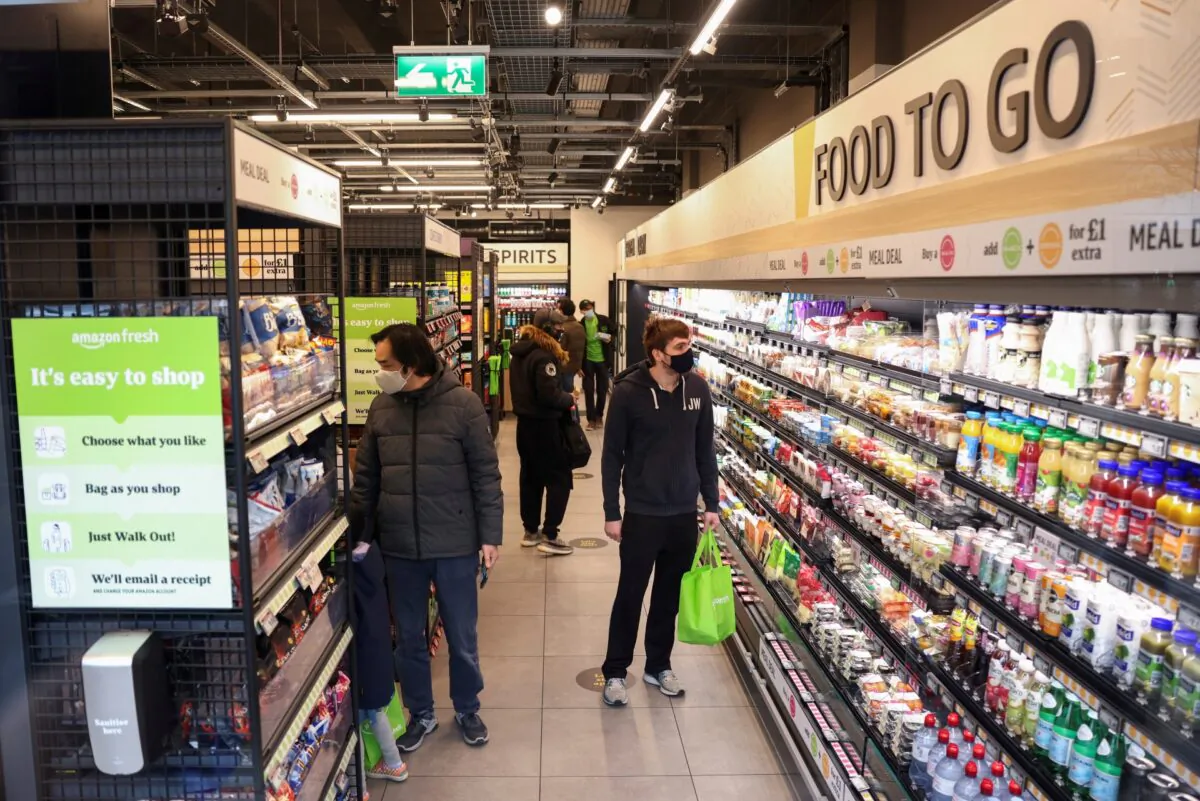 Customers shop at the UK's first Amazon Fresh supermarket in London, on March 4, 2021. (Henry Nicholls/Reuters)