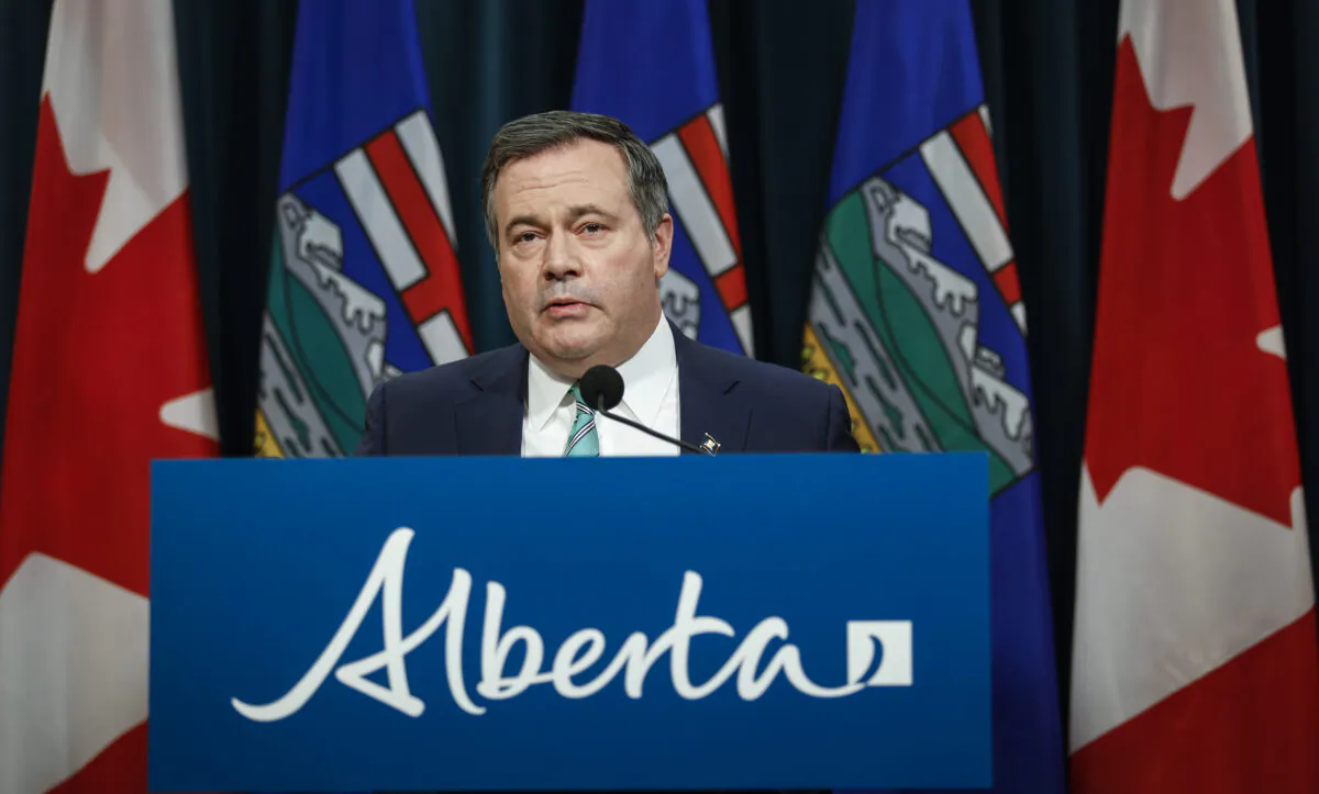 Alberta Premier Jason Kenney gives a COVID-19 update in Calgary on Feb. 8, 2022. (Jeff McIntosh/The Canadian Press)