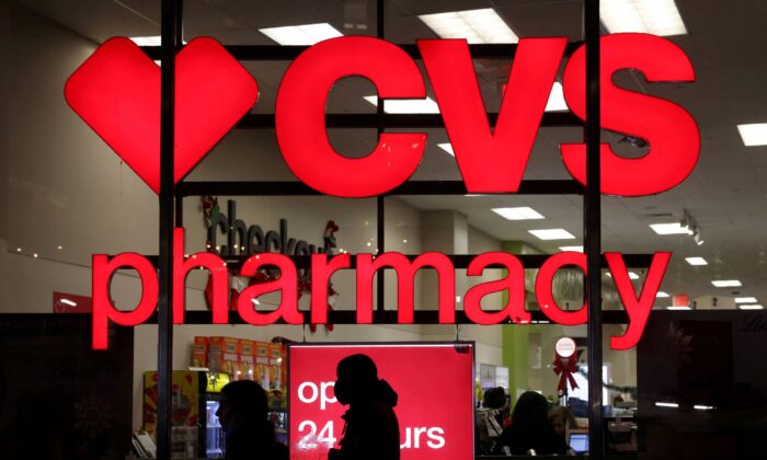People walk by a CVS pharmacy store in Manhattan, New York, on Nov. 17, 2021. Some over-the-counter antihistamines have been shown to be effective against long COVID symptoms. (Andrew Kelly/Reuters)