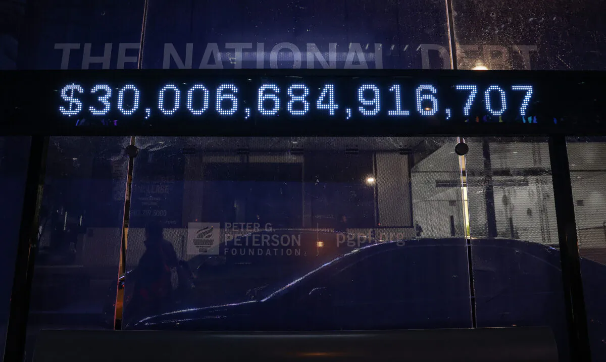 A Peterson Foundation billboard displaying the national debt is pictured on K Street in downtown Washington on Feb. 8, 2022. (Jemal Countess/Getty Images for Peter G. Peterson Foundation)