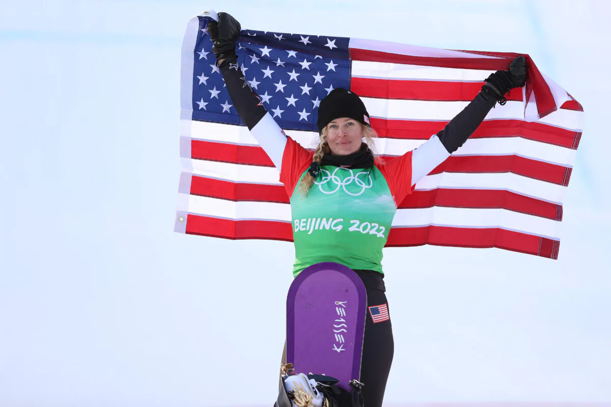 Gold medalist Lindsey Jacobellis of Team United States poses during the Women's Snowboard Cross flower ceremony on Day 5 of the Beijing 2022 Winter Olympic Games at Genting Snow Park in Zhangjiakou, China, on Feb. 9, 2022. (Ezra Shaw/Getty Images)