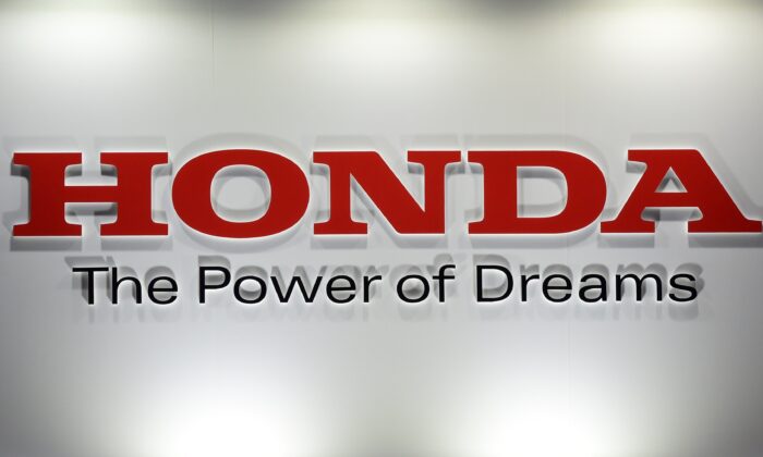 A logo of Japanese auto giant Honda Motor is displayed at the Smart Community exhibition in Tokyo, on June 17, 2015. (Yoshikazu Tsuno/AFP via Getty Images)