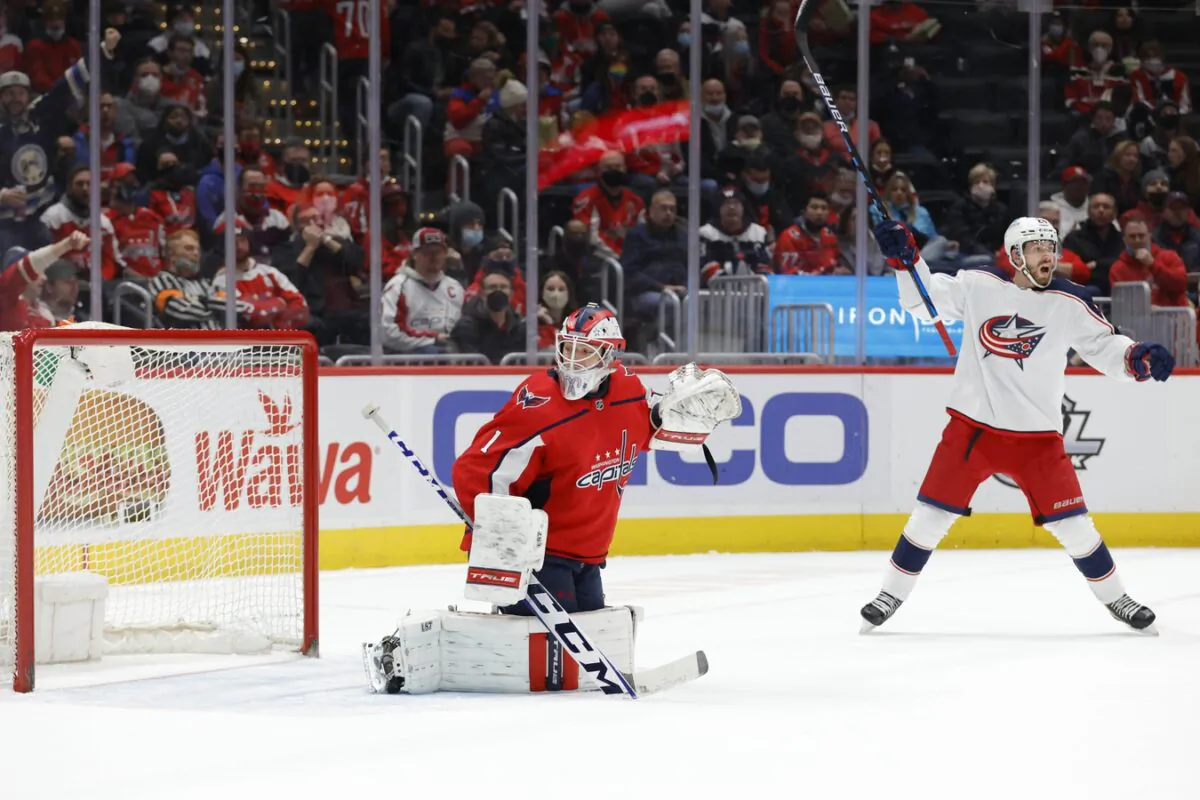 Columbus Blue Jackets right wing Oliver Bjorkstrand (28) celebrates as Washington Capitals goaltender Pheonix Copley (1) is beaten by a shot from Blue Jackets left wing Patrik Laine (not pictured) during the second period at Capital One Arena in Washington, on Feb. 8, 2022. (Geoff Burke/USA TODAY Sports via Field Level Media)