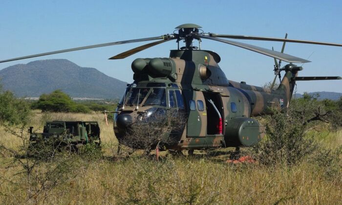 A South African military helicopter near a base in Mozambique. The Southern African Development Community anti-insurgency operation in Mozambique has only two such aircraft at its disposal. (Courtesy of South African National Defense Force) 