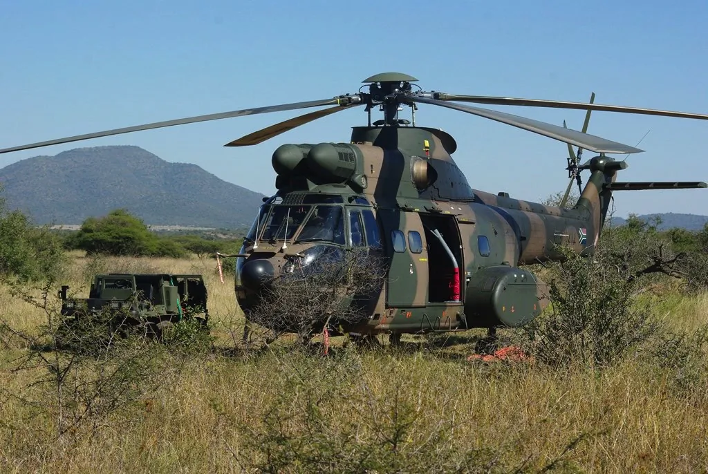 A South African military helicopter near a base in Mozambique. The Southern African Development Community anti-insurgency operation in Mozambique has only two such aircraft at its disposal. (Courtesy of South African National Defense Force)