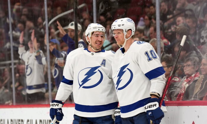 Tampa Bay Lightning right wing Corey Perry (10) celebrates his goal against the Arizona Coyotes with defenseman Ryan McDonagh (27) during the first period at Gila River Arena in US, on Feb 11, 2022. (Joe Camporeale /USA TODAY Sports via Field Level Media)