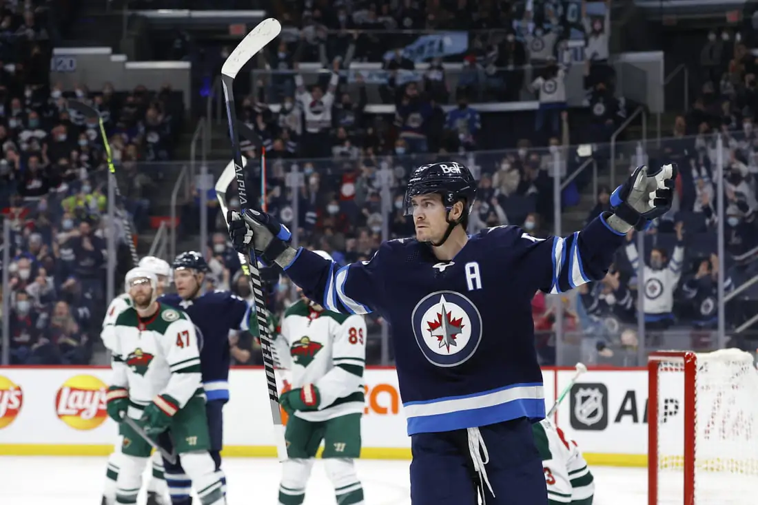 Winnipeg Jets center Mark Scheifele (55) celebrates his second period goal against the Minnesota Wild at Canada Life Centre, Winnipeg, Manitoba, Canada, on Feb 16, 2022. (James Carey Lauder/USA TODAY Sports via Field Level Media)