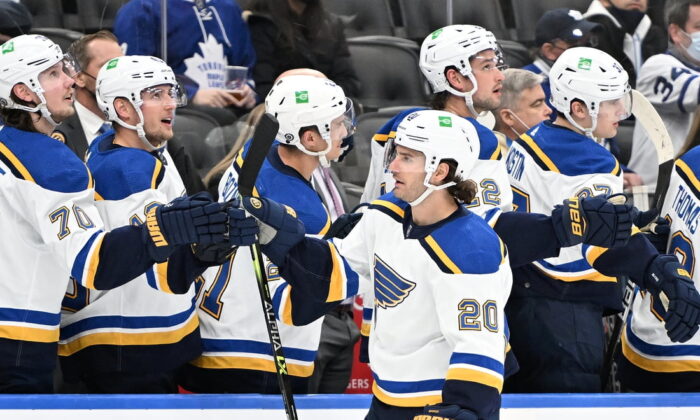 St. Louis Blues forward Brandon Saad (20) celebrates with team mates at the bench after scoring against the Toronto Maple Leafs in the third period at the Scotiabank Arena in Toronto, on Feb. 19, 2022. (Dan Hamilton/USA TODAY Sports via Field Level Media)
