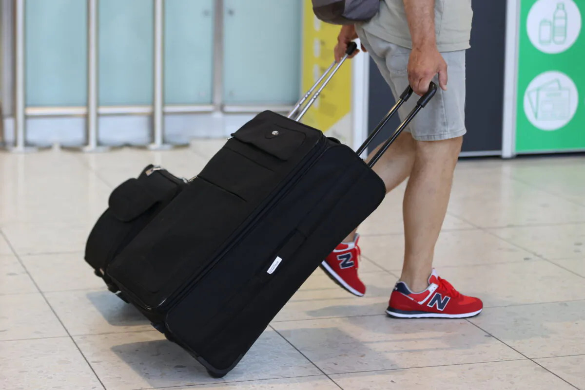 A passenger in Terminal 1 at Dublin Airport on July 19, 2021. (Liam McBurney/PA)