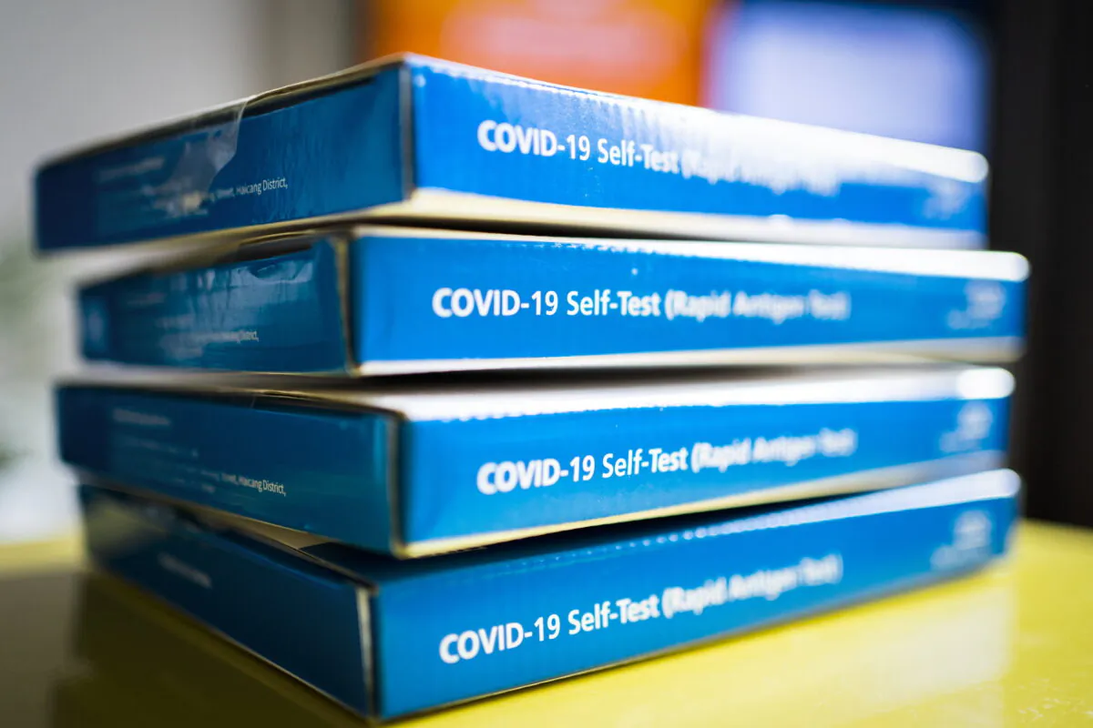 This undated file image shows a pile of COVID-19 lateral flow tests (PA. 