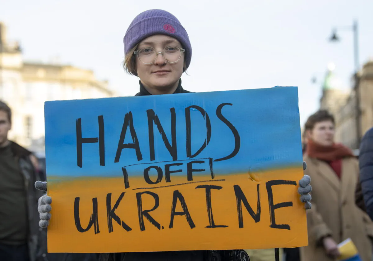 People take part in a demonstration outside the Russian Consulate General in Edinburgh on Feb. 26, 2022. (Lesley Martin/PA)