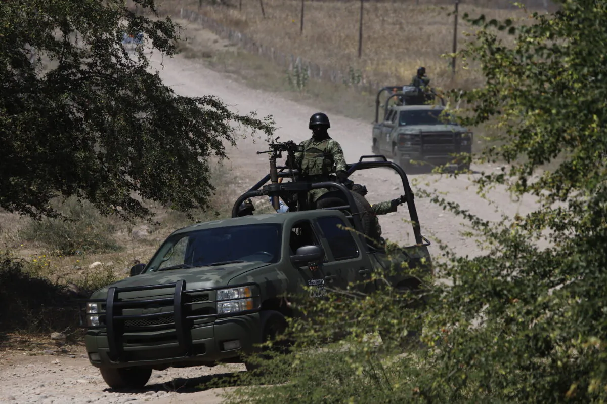 Mexican soldiers patrol near Naranjo de Chila in the municipality of Aguililla, Mexico, on Feb. 18, 2022. (Armando Solis/AP Photo)