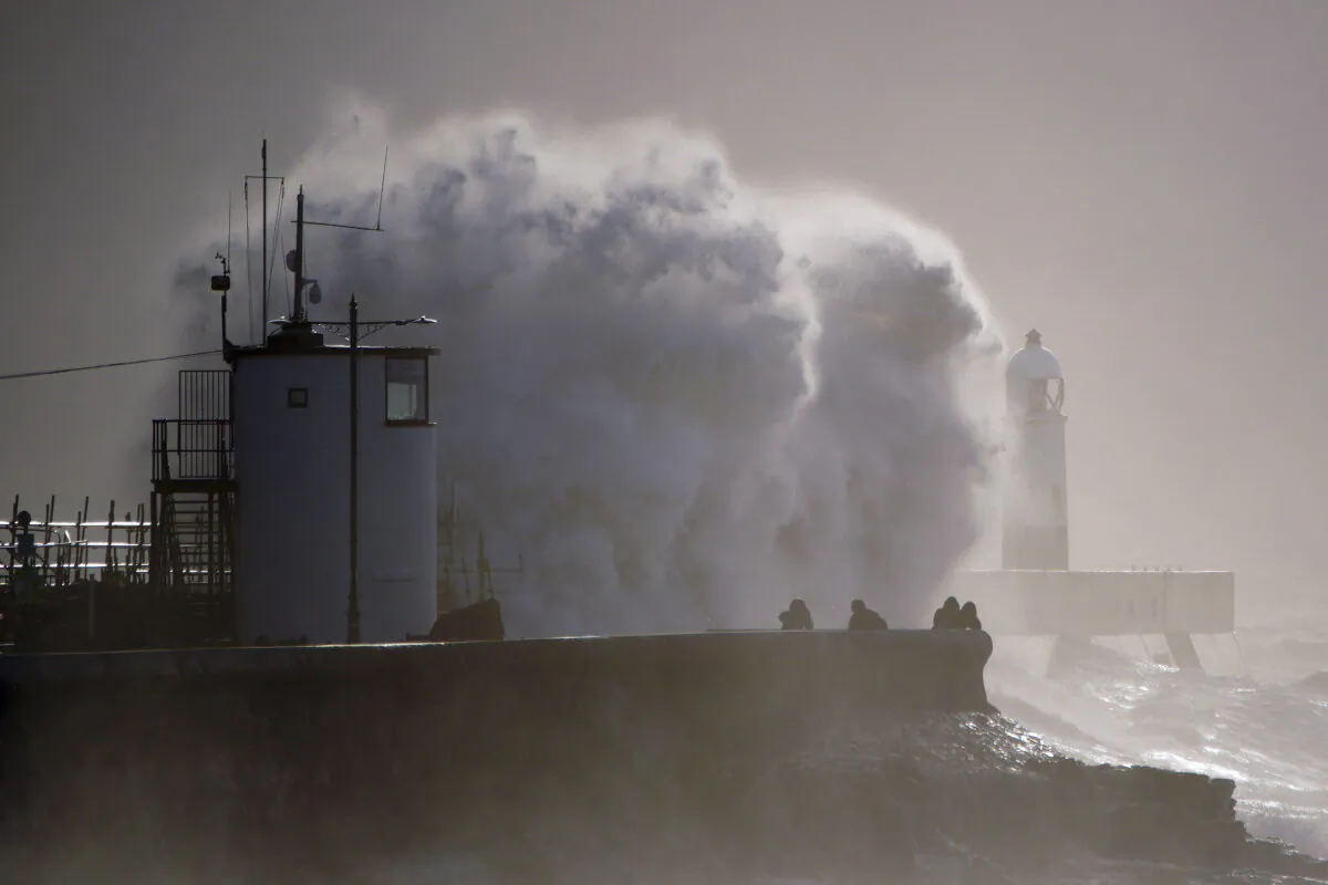 Huge waves hitting the sea wall after Storm Franklin moved in overnight in Porthcawl, Wales, Britain on Feb. 21, 2022. (Ben Birchall/PA via AP)