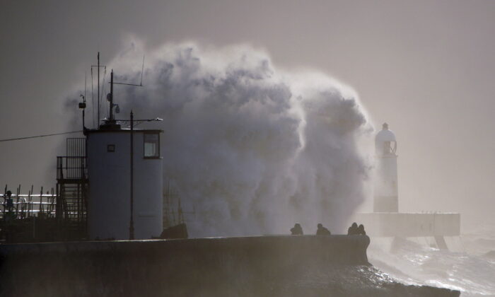 Huge waves hitting the sea wall after Storm Franklin moved in overnight in Porthcawl, Wales, Britain on Feb. 21, 2022. (Ben Birchall/PA via AP)