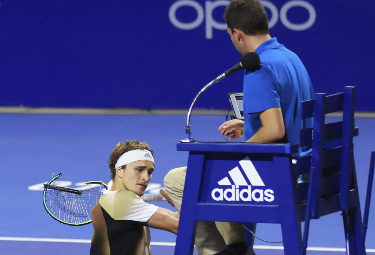 Third-ranked Alexander Zverev of Germany smashes his racket on the umpire's chair moments after losing a doubles match of the Mexican Open tennis tournament in Acapulco, Mexico, on Feb. 22, 2022. (Marcos Dominguez/MexTenis via AP)