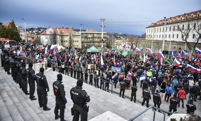 Thousands of Slovaks rally to protest a defense military treaty between this NATO member and the United States, in Bratislava, Slovakia, on Feb. 8, 2022. (Pavol Zachar/TASR via AP)