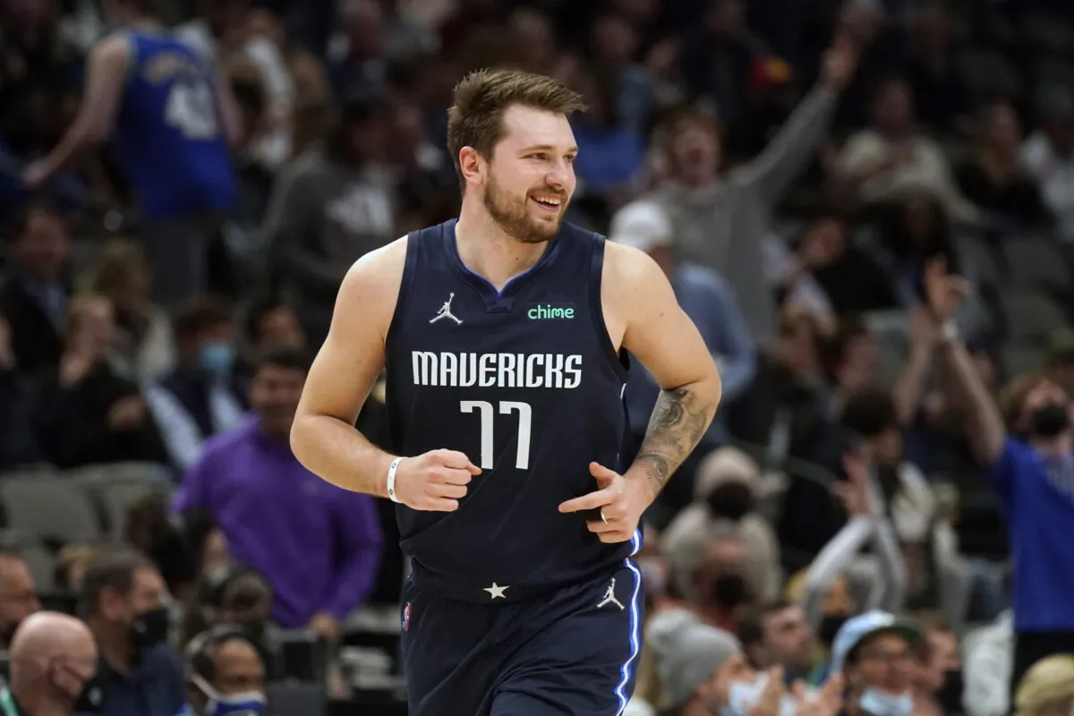Dallas Mavericks guard Luka Doncic (77) smiles after hitting a 3-pointer during the first quarter of the team's NBA basketball game against the Los Angeles Clippers in Dallas on Feb. 10, 2022. (LM Otero/AP Photo)