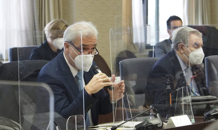 Gustavo Caruso (L) director and safety coordination of the IAEA taskforce, speaks during a meeting with the government officials, at the ministry in Tokyo, Japan, on Feb. 14, 2022. (METI via AP)
