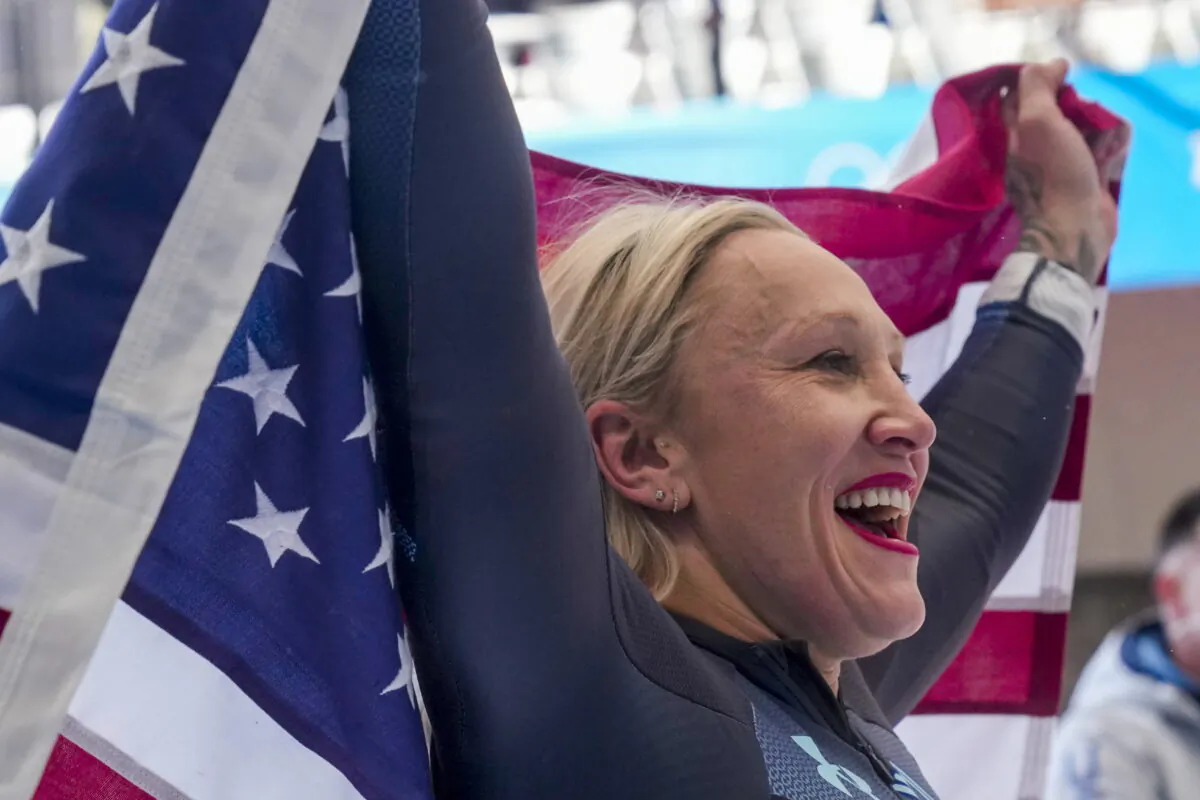 Kaillie Humphries of the United States celebrates winning the gold medal in the women's monobob at the 2022 Winter Olympics in the Yanqing district of Beijing, on Feb. 14, 2022. (Mark Schiefelbein/AP Photo)