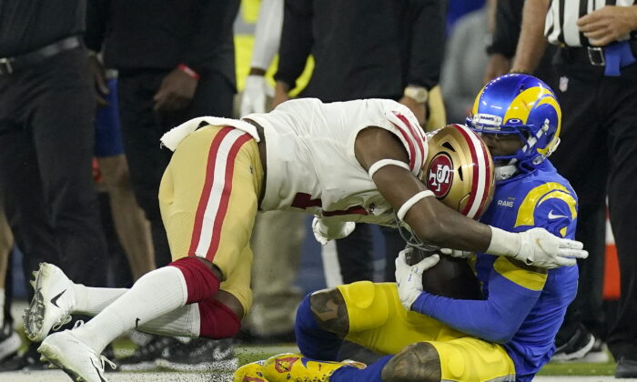 San Francisco 49ers' Jimmie Ward, left, is called for a penalty as he hits Los Angeles Rams' Odell Beckham Jr. during the second half of the NFC Championship NFL football game in Inglewood, Calif., on Jan. 30, 2022.  (Mark J. Terrill/AP Photo)