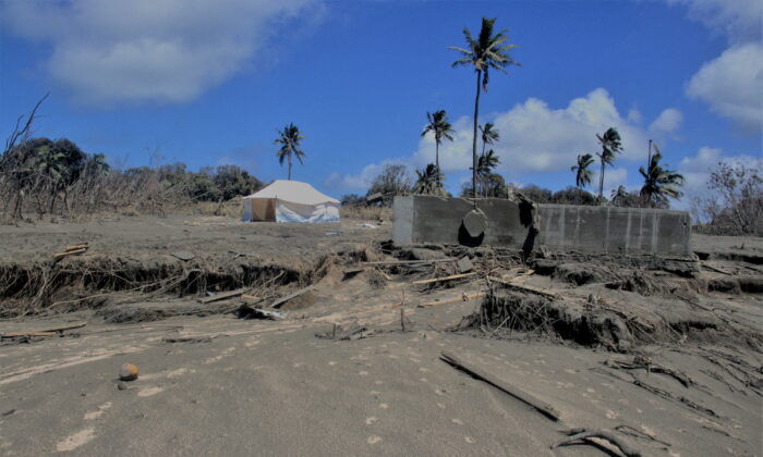 A general view shows damaged buildings and landscape covered with ash following the volcanic eruption and tsunami in Kanokupolu, Tonga, on Jan. 23, 2022. (Tonga Red Cross Society/Handout via Reuters)