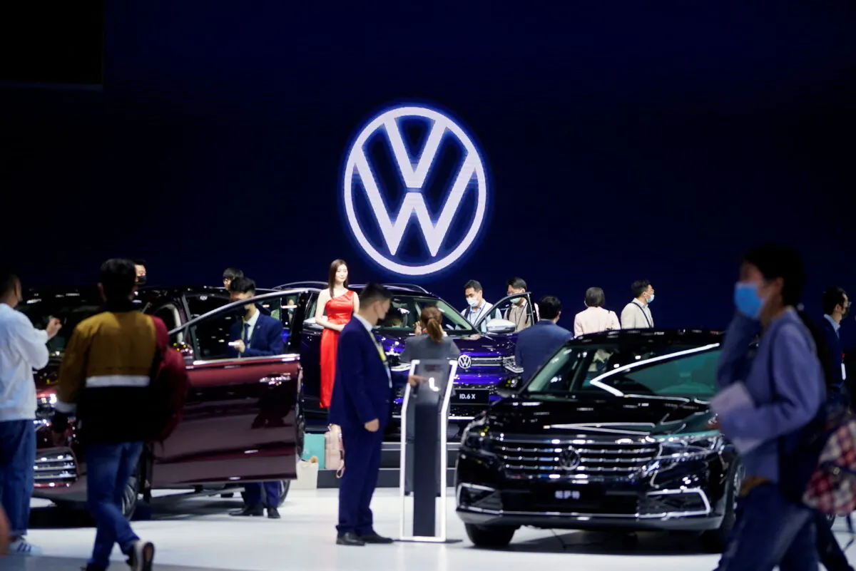 People visit the Volkswagen booth during a media day for the Auto Shanghai show in Shanghai, China, on April 19, 2021. (Aly Song/File Photo /Reuters)