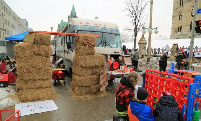 Children play at an improvised play area at the protest site where demonstrators have camped to protest against COVID-19 mandates and restrictions, in Ottawa on Feb. 9, 2022. (Jonathan Ren/The Epoch Times)