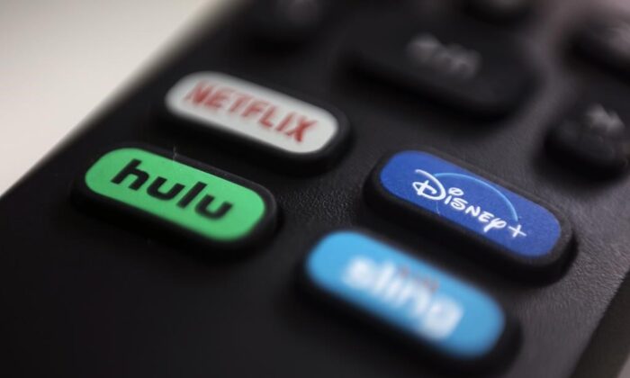The logos for streaming services Netflix, Hulu, Disney Plus, and Sling TV are pictured on a remote control in Portland, Ore., on Aug. 13, 2020. (Jenny Kane/AP)