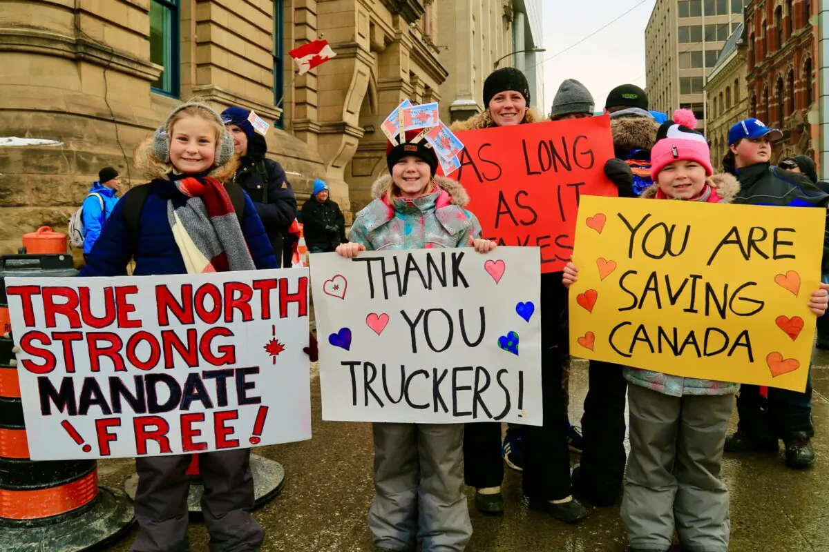 Protesters take part in the Freedom Convoy demonstration against COVID-19 mandates and restrictions in Ottawa on Feb. 9, 2022. (Jonathan Ren/The Epoch Times)